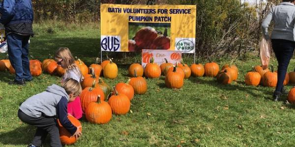 families at a pumpkin patch